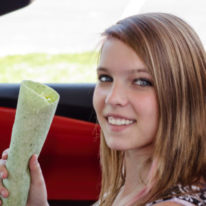 girl holding tortilla wrap