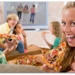 smiling blonde girl excited to eat pizza